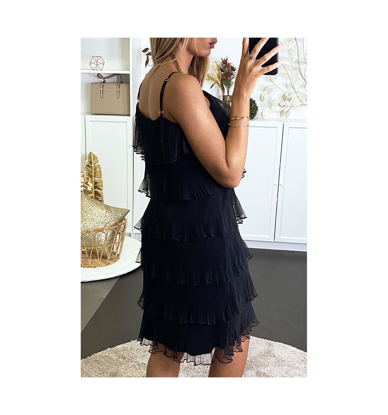 Black Charleston-style dress with ruffles.