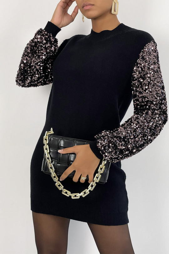 Robe pull noir avec manches à paillettes et col montant parfaite pour une soirée Robe pull noir avec manches à paillettes et col montant parfaite pour une soirée