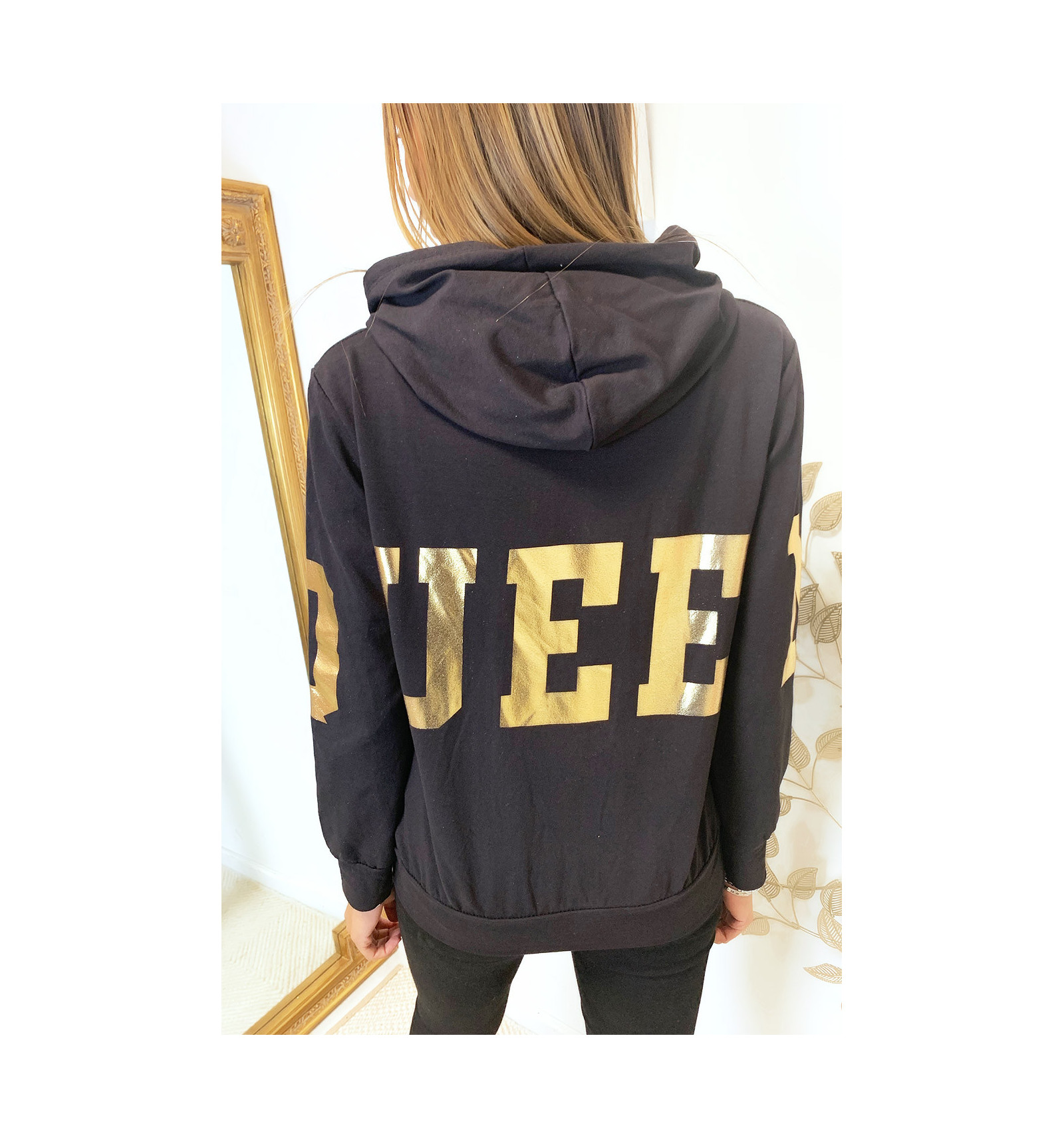 black hoodie with gold writing