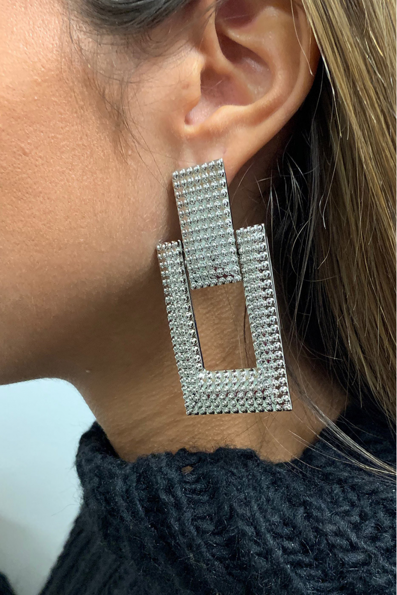 Boucle d'oreille argenté. Boucle d'oreille argenté.