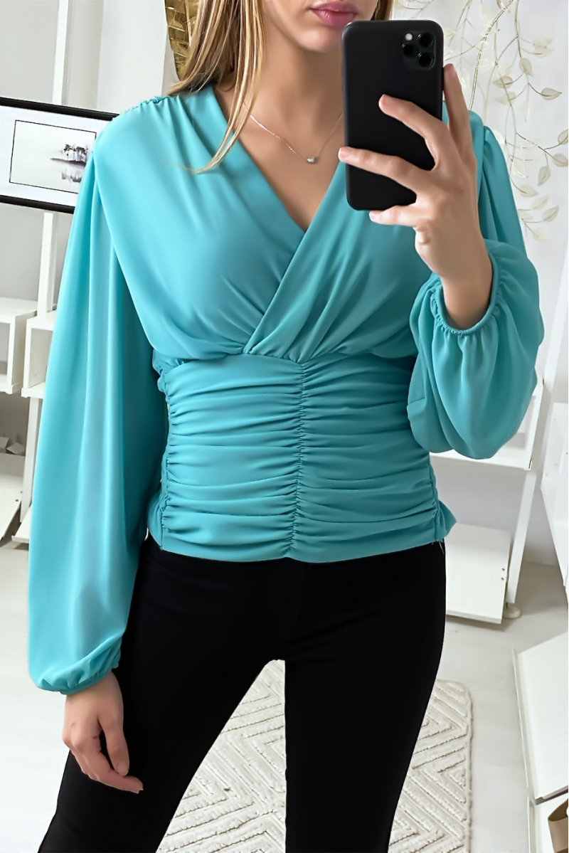 Blouse turquoise croisé au buste et cintré à la taille Blouse turquoise croisé au buste et cintré à la taille