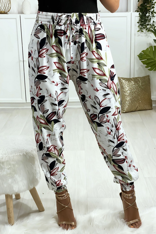 Pantalon blanc motif fleuris elastique aux chevilles avec poches Pantalon blanc motif fleuris elastique aux chevilles avec poches