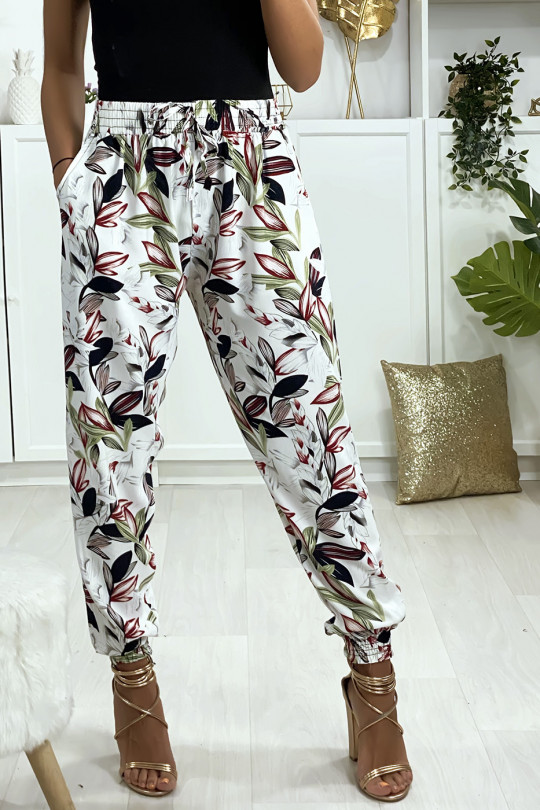 Pantalon blanc motif fleuris elastique aux chevilles avec poches Pantalon blanc motif fleuris elastique aux chevilles avec poches