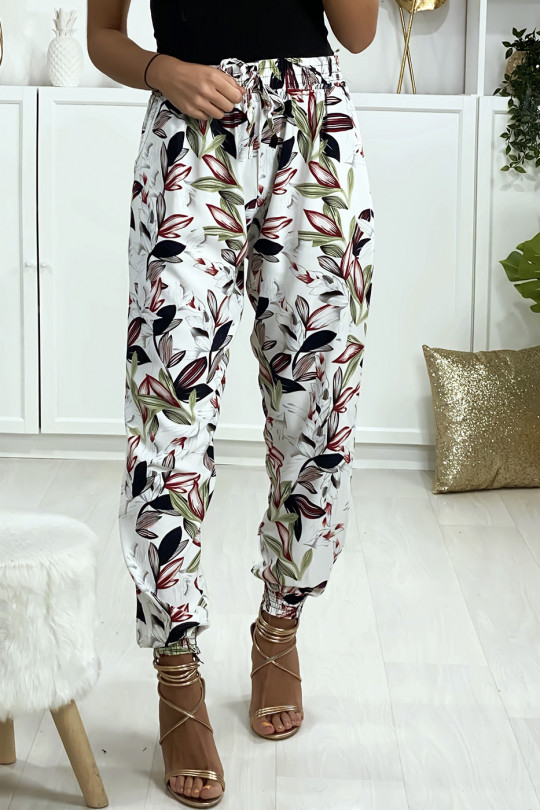 Pantalon blanc motif fleuris elastique aux chevilles avec poches Pantalon blanc motif fleuris elastique aux chevilles avec poches