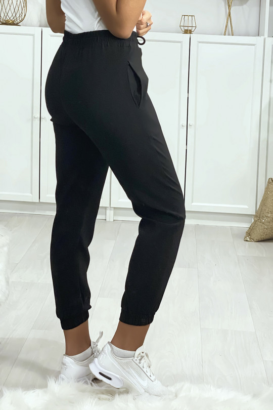Pantalon jogging noir avec poche serré en bas Pantalon jogging noir avec poche serré en bas