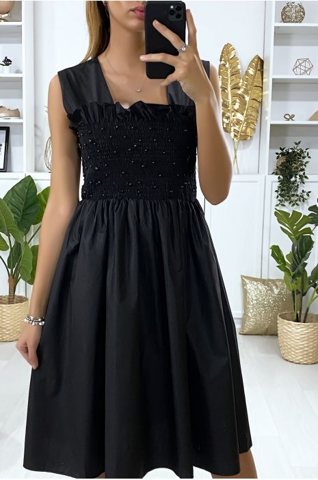 black dress with pearls