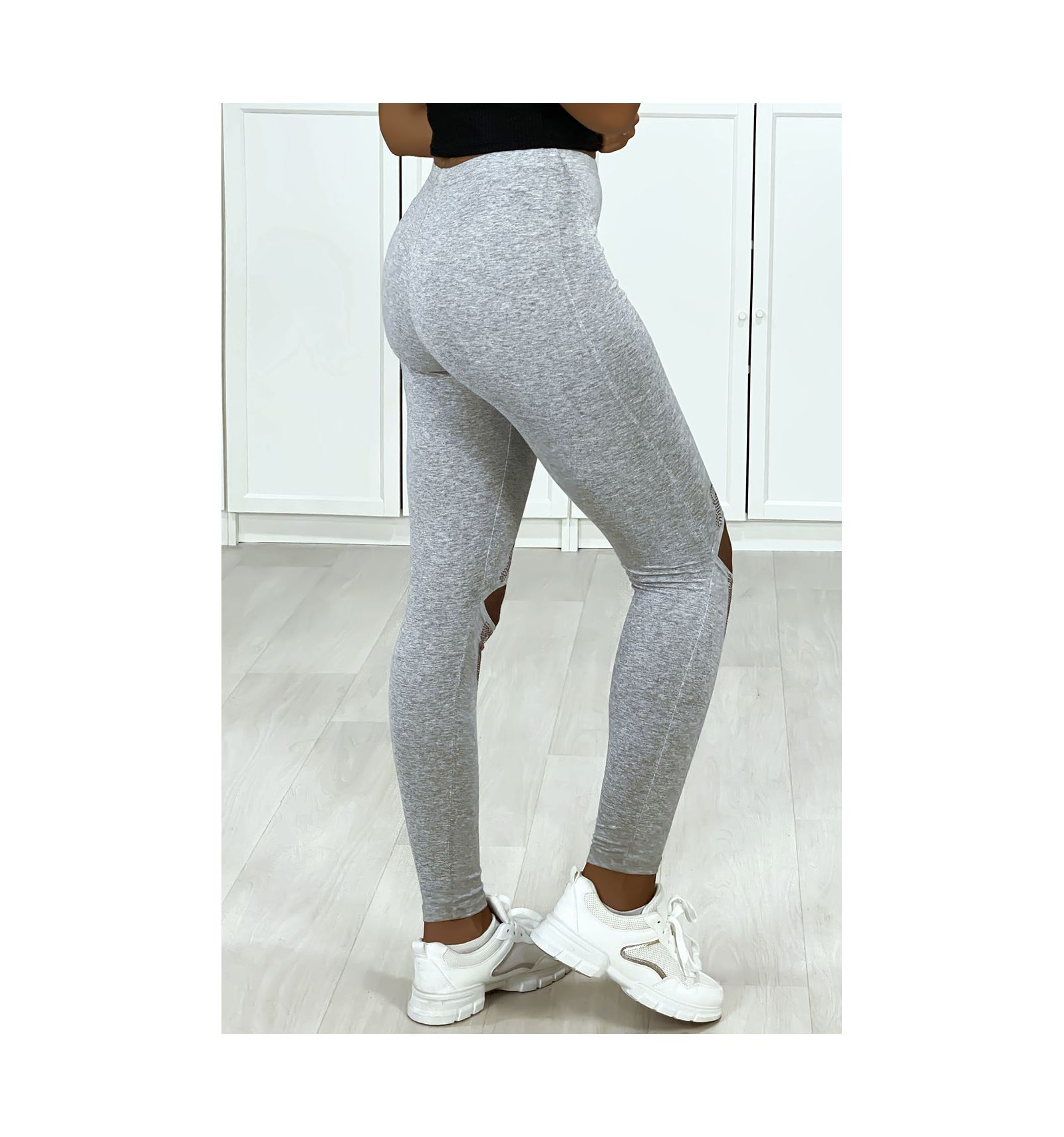 Gray cotton leggings for women with openings and rhinestones at the knees.